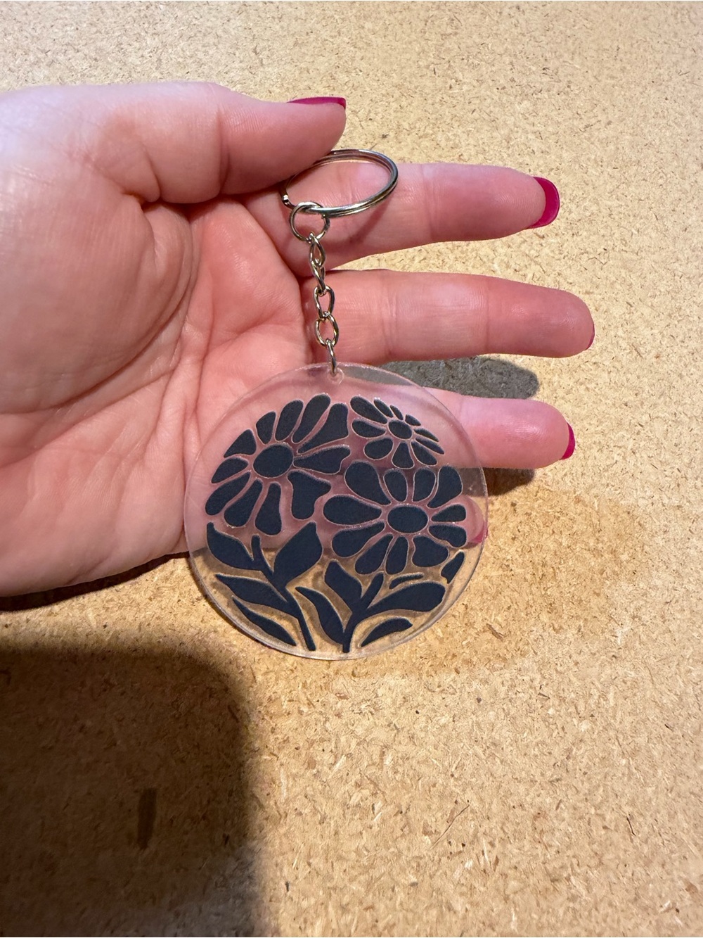 Clear Acrylic Floral Keychain with Black Flower Design